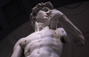 Low angle view of Michelangelo's David in the Gallery of the Academy of Florence